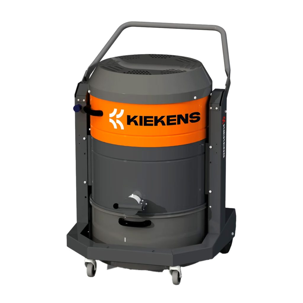 Aspirador industrial Kiekens KE1000 monofásico, compacto y robusto, con chasis metálico y ruedas para fácil movilidad en entornos industriales.